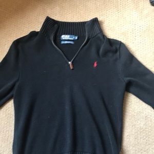 Black polo half zip sweater.